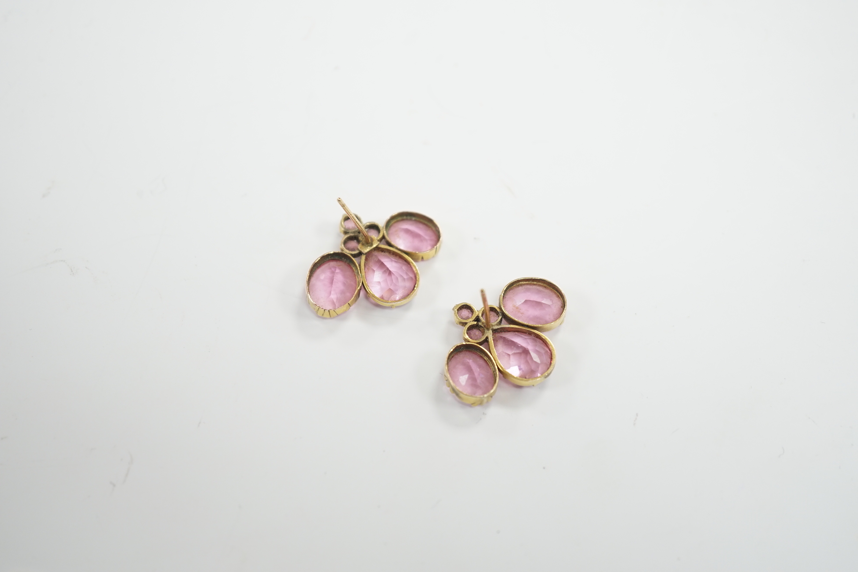 A pair of early 20th century yellow metal and pink paste cluster ear studs, width 26mm, gross weight 8.2 grams.